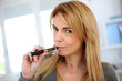 Woman smoking with electronic cigarette
