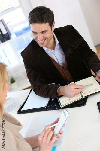 Photo: Woman meeting lawyer to set up her own business Woman meeting lawyer to set up her own business