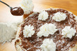 Italian Pizza, ingredients in the background on a wood table