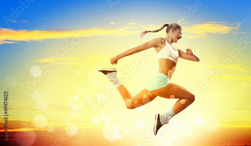 Photo: Image of sport woman jumping Image of sport woman jumping