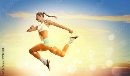 Photo: Image of sport woman jumping Image of sport woman jumping