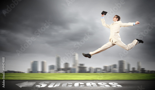 Photo: Businessman running on the road Businessman running on the road