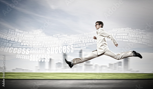 Photo: Businessman running on the road Businessman running on the road