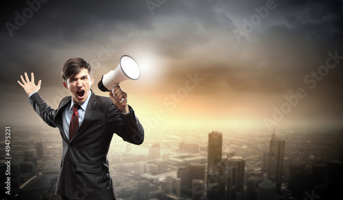 Photo: businessman with megaphone businessman with megaphone