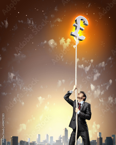 Photo: Image of businessman climbing rope Image of businessman climbing rope