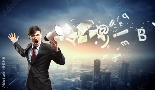Photo: businessman with megaphone businessman with megaphone