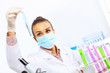 Photo: Young female scientist working in laboratory Young female scientist working in laboratory