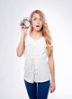 beautiful girl holding a retro alarm clock