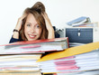 Business woman in the office has a headache and to much work