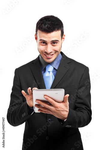 Photo: Businessman using his tablet Businessman using his tablet