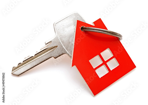 Photo: House shaped keychain isolated on white background House shaped keychain isolated on white background