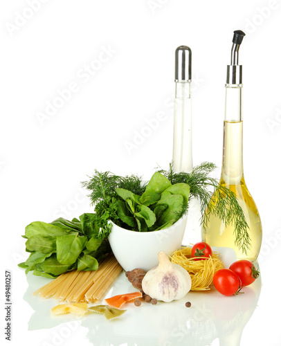 Photo: Composition of mortar, pasta and green herbals, isolated Composition of mortar, pasta and green herbals, isolated