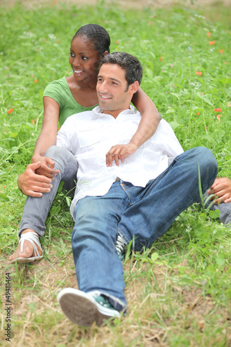 Photo: Mixed-race couple in park Mixed-race couple in park