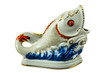 A porcelain figure of a fish.