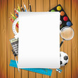 School supplies and empty paper on wooden background