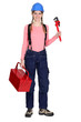 Tradeswoman with a pipe wrench