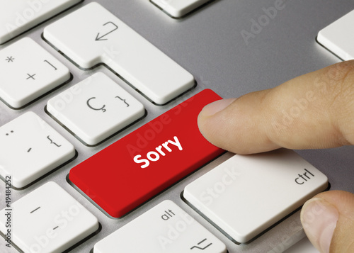Photo: Sorry keyboard key. Finger Sorry keyboard key. Finger