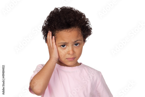 Photo: Sad latin child with headache Sad latin child with headache