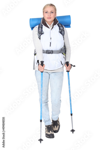 Photo: blonde woman ready for a mountain excursion in winter blonde woman ready for a mountain excursion in winter