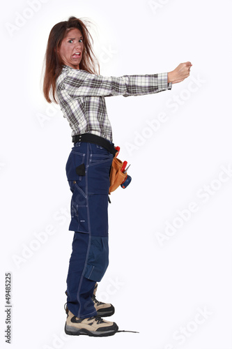 Photo: An electrocuted woman hanging onto an invisible object An electrocuted woman hanging onto an invisible object