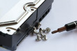 Screwdriver and screws near hard drive