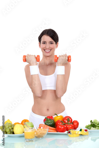 Photo: Young woman getting fit Young woman getting fit