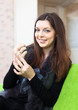 woman stares at nails at home