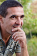 Smiling pensive man