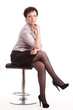 adult businesswoman sitting on chair over white