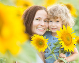 Happy family with beautiful sunflowers