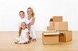 Woman and kids unpacking in their new home
