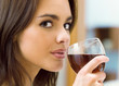 Young woman with glass of redwine