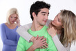 couple in love and jealous woman in background