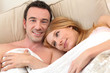 Photo: Smiling couple in bed Smiling couple in bed