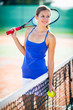 Photo: Portrait of a pretty young tennis player Portrait of a pretty young tennis player