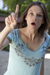 young woman warning someone
