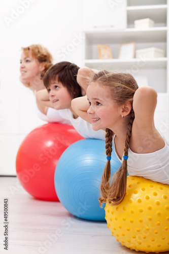 Photo: Happy healthy kids exercising Happy healthy kids exercising