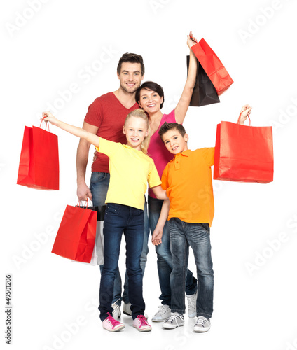 Photo: family with shopping bags standing at studio family with shopping bags standing at studio