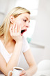 Bored woman yawning