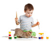 kid drawing paints with cat