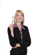 woman in a suit holding her glasses