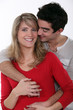 Couple hugging in studio
