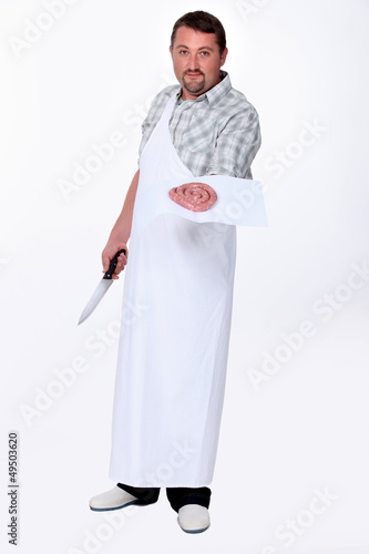 Photo: Man holding out sausage Man holding out sausage