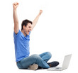 Excited young man using laptop