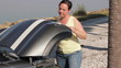 Woman opens hood of her car
