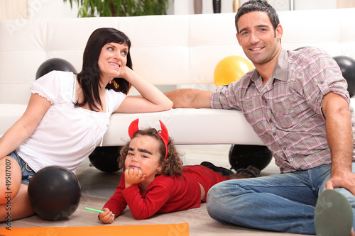 Photo: Parents with children dressed as devil Parents with children dressed as devil