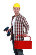 Man with a toolbox and powerdrill