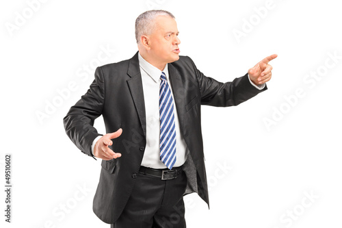 Photo: Angry boss having arguing and pointing with finger Angry boss having arguing and pointing with finger