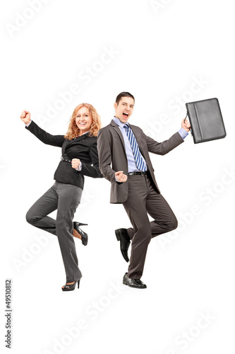 Photo: Full length portrait of a happy businesspeople gesturing happine Full length portrait of a happy businesspeople gesturing happine