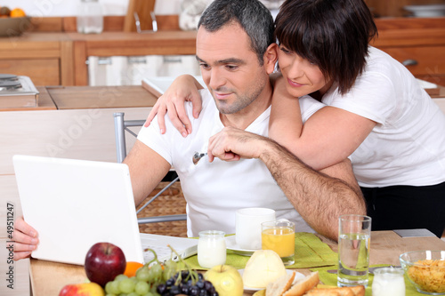 Photo: Couple having breakfast together Couple having breakfast together